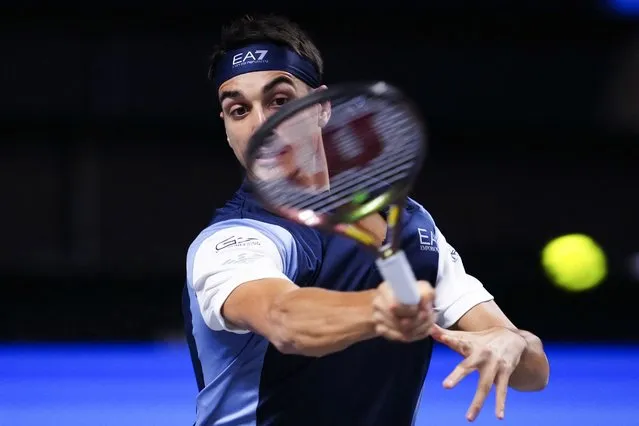 Italy's Lorenzo Sonego returns the ball to Italy's Jannik Sinner during their round of 16 men's singles match of the Erste Bank Open tennis tournament in Vienna on October 26, 2023. (Photo by Eva Manhart/APA via AFP Photo)