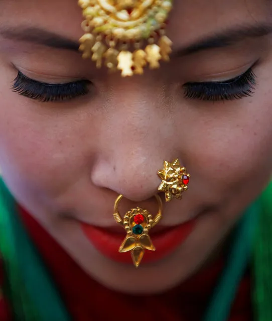 An adorned Gurung girl wearing a traditional costume and ornaments is seen during Tamu Lhosar or Losar (New Year) parade in Kathmandu, Nepal December 30, 2016. Members of the community in Nepal celebrate Tamu Lhosar or Losar with a feast and various cultural programs to usher in the Gurung community's year of the bird. (Photo by Navesh Chitrakar/Reuters)