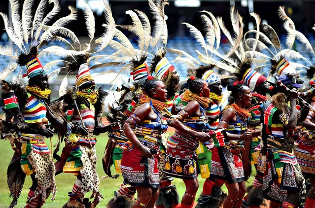 Traditional dancers perform at the Kasarani stadium in Nairobi on December 12, 2013 during celebrations marking half a century of independence from Britain. Kenyans marked 50 years of independence, celebrating progress of the regional economic powerhouse but also struggling to shake off a legacy of corruption, inequality and ethnic violence. (Photo by Simon Maina/AFP Photo)