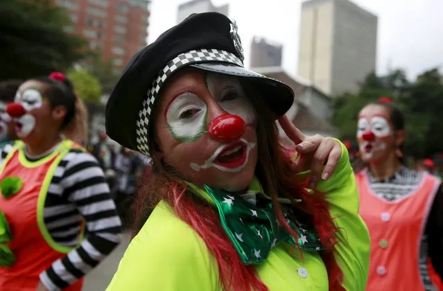 Clowns perform in a street parade as part of the opening ceremony of the Ibero-American Theater Festival in Bogota, Colombia, March 12, 2016. (Photo by John Vizcaino/Reuters)