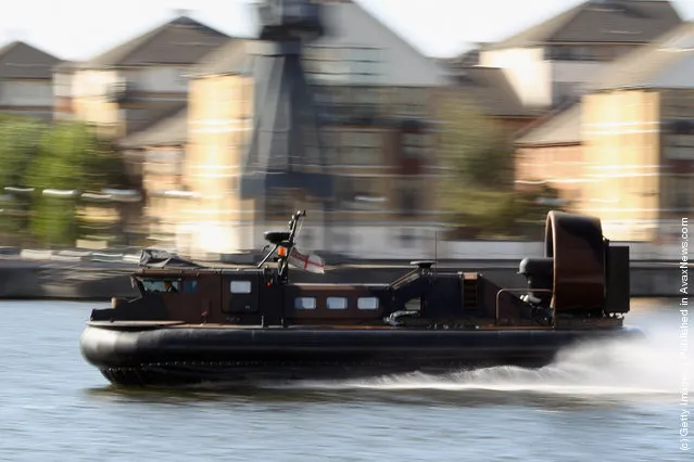 A hovercraft performs a demonstration in Albert dock outside the ExCel centre