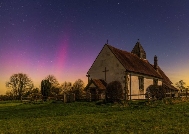 The northern lights on Saturday evening, March 23, 2024 at St Hubert’s Church at Idsworth in Hampshire, UK.  The aurora was captured with a single eight-second exposure. (Photo by Nick Bull/Picture Exclusive)