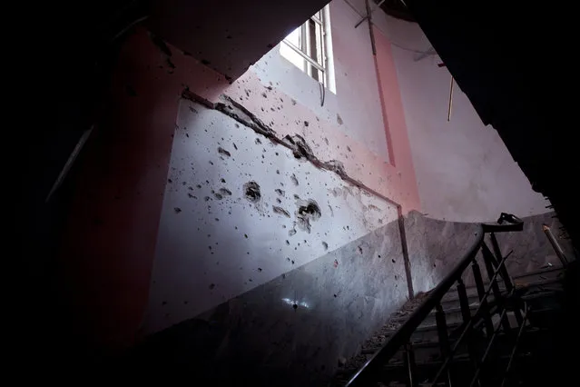 A stairwell at the library of the University of Anbar in the Iraqi city of Ramadi shows heavy damage in this March 20, 2016 photo. The campus served as headquarters for the Islamic State group before Iraqi forces retook the city earlier this year. As they retreated, the militants set fires in some university buildings and blew up others. (Photo by Maya Alleruzzo/AP Photo)