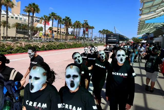 Characters from the Scream series walk outside the Convention Center at the 2015 Comic-Con International in San Diego, California July 10, 2015. (Photo by Sandy Huffaker/Reuters)