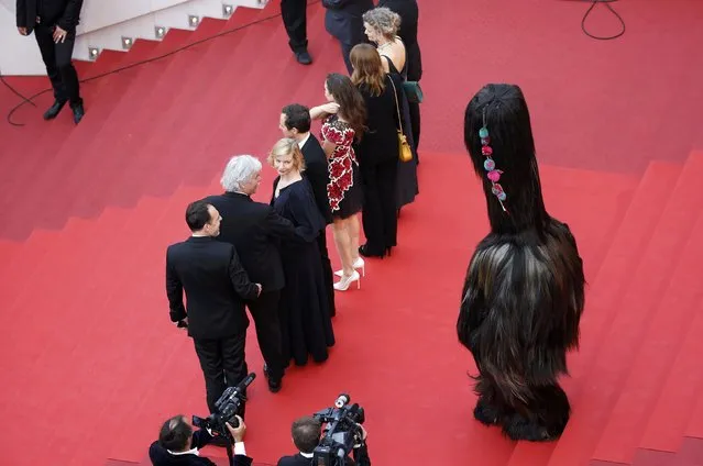 Director Maren Ade, cast members Lucy Russell, Ingrid Bisu, Peter Simonischek, Trystan Putter, Sandra Huller, and Thomas Loibl pose on the red carpet as they leave after the screening of the film “Toni Erdmann” in competition at the 69th Cannes Film Festival in Cannes, France, May 14, 2016. (Photo by Regis Duvignau/Reuters)
