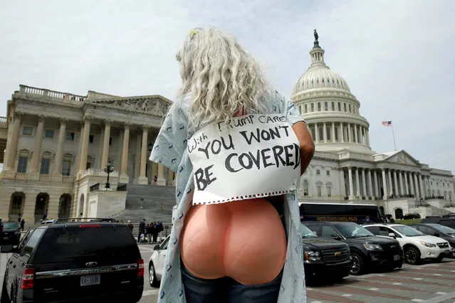 A protester rallies during U.S. House voting on the American Health Care Act, which repeals major parts of the 2000 Affordable Care Act know as Obamacare on Capitol Hill in Washington, U.S., May 4, 2017. (Photo by Yuri Gripas/Reuters)
