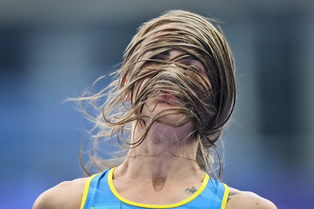 Kazakhstan's Nadezhda Dubovitskaya reacts as she competes in the women's high jump qualification of the athletics event at the Paris 2024 Olympic Games at Stade de France in Saint-Denis, north of Paris, on August 2, 2024. (Photo by Andrej Isakovic/AFP Photo)