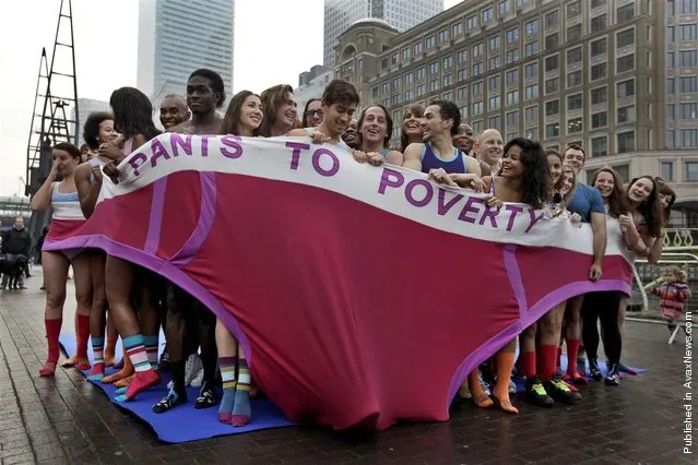 Participants in their underwear break a world record for the most number of people, 57, to fit into an oversized pair of underpants. They look like they're freezing standing in the Canary Wharf district of London, on Nov. 17, 2011