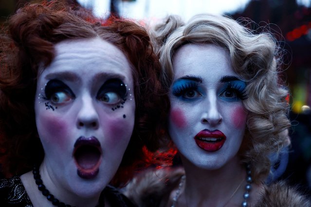 Members of street performance troupe Macnas perform during a Halloween parade called “Cnamha La Loba” in Galway, Ireland on October 29, 2023. (Photo by Clodagh Kilcoyne/Reuters)