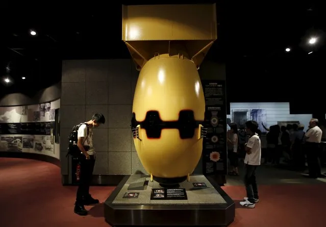 Visitors look at a mock Nagasaki-type atomic bomb named “Fat Man” at the Nagasaki Atomic Bomb Museum in Nagasaki, western Japan, August 8, 2015, on the eve of the 70th anniversary of the bombing of Nagasaki. Japan will mark on Sunday the 70th anniversary of the attack on Nagasaki, where the U.S. dropped a second atomic bomb on August 9, 1945, which killed about 40,000 instantly. (Photo by Toru Hanai/Reuters)