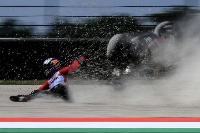 Gresini Racing Ducati's Italian rider Enea Bastianini falls during free practice 3 ahead the Italian Moto GP Grand Prix at the Mugello race track, Tuscany, on May 28, 2022. (Photo by Filippo Monteforte/AFP Photo)