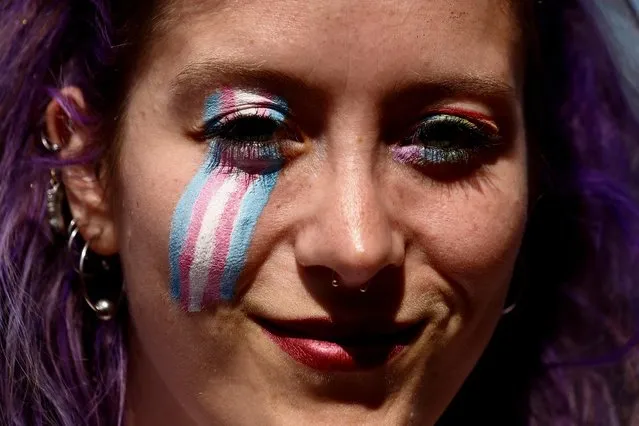 A person looks on while attending an LGBTQ+ Pride parade in Rome, Italy, June 11, 2022. (Photo by Yara Nardi/Reuters)