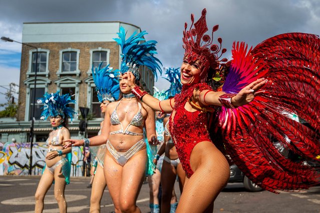 Costumed participants from the London School of Samba takes part in the Grand Finale of Notting Hill Carnival in London, UK on August 28, 2023. Europe's largest street festival runs over two days and celebrates Caribbean culture and is expected to have welcomed over 1 million people each day. (Photo by Stephen Chung/Alamy Live News)