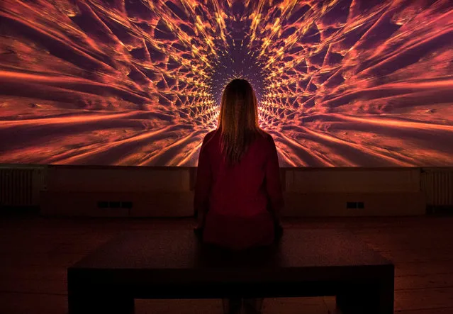 A woman looks at Doug Foster’s Beyond the Infinite, a widescreen tunnel inspired by the famous Stargate sequence in “2001: A Space Odyssey”, during a press preview of the “Daydreaming With Stanley Kubrick” exhibition at Somerset House in London, England on July 5, 2016. (Photo by Lauren Hurley/PA Wire)