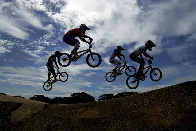 Cyclists compete in the men's cycling BMX heat during the Bolivarian Games in Valledupar, Colombia, Friday, July 1, 2022. (Photo by Fernando Vergara/AP Photo)