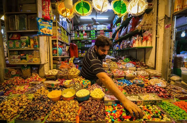 Iraqi people do shopping ahead of Eid al-Adha at Shorca Bazaar in Baghdad, Iraq on July 06, 2022. (Photo by Murtadha Al-Sudani/Anadolu Agency via Getty Images)