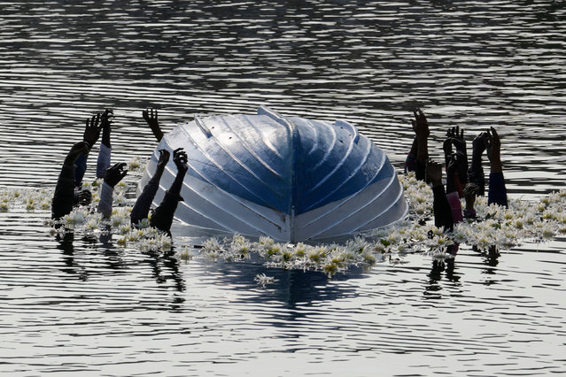 An installation created by Milan's municipality is displayed at the Darsena del Naviglio canal in memory of a fishing boat packed with some 500 African migrants which capsized in 2013 off the shores of the Sicilian island of Lampedusa, in Milan, Italy, Thursday, October 5, 2023. (Photo by Luca Bruno/AP Photo)