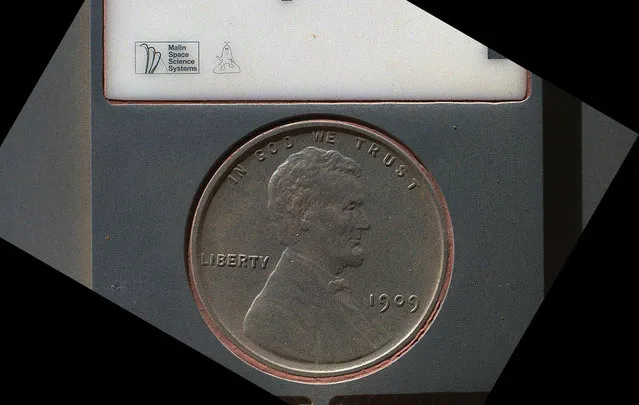 The penny in this image is part of a camera calibration target on NASA's Mars rover Curiosity. The MAHLI camera on the rover took this and other images of the MAHLI calibration target on September 9, 2012. The penny is a nod to geologists' tradition of placing a coin or other object of known scale as a size reference in close-up photographs of rocks, and it gives the public a familiar object for perceiving size easily when it will be viewed by MAHLI on Mars. The specific coin, provided by MAHLI's principal investigator, Ken Edgett, is a 1909 "VDB" penny. That was the first year Lincoln pennies were minted and the centennial of Abraham Lincoln's birth. The VDB refers to the initials of the coin's designer, Victor D. Brenner, which are on the reverse side. The calibration target for the Mars Hand Lens Imager (MAHLI) instrument also includes a “Joe the Martian” character, color references, a metric bar graphic, and a stair-step pattern for depth calibration. (Photo by NASA/JPL-Caltech/Malin Space Science Systems)