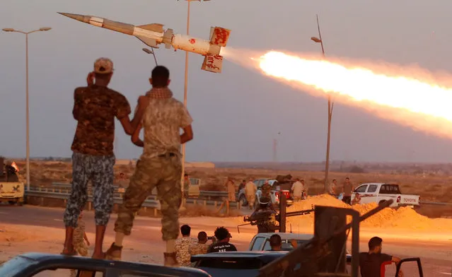 "Fighters of Libyan forces allied with the U.N.-backed government fire a rocket at Islamic State fighters in Sirte, Libya, August 4, 2016. (Photo by Goran Tomasevic/Reuters)