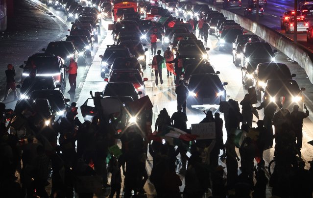 Anti-deportation supporters block the 101 freeway while protesting the Trump administration's deportations on February 02, 2025 in Los Angeles, California. Thousands marched and protested against Immigration and Customs Enforcement (ICE) and mass deportations in downtown Los Angeles, creating gridlock in the area. (Photo by Mario Tama/Getty Images)