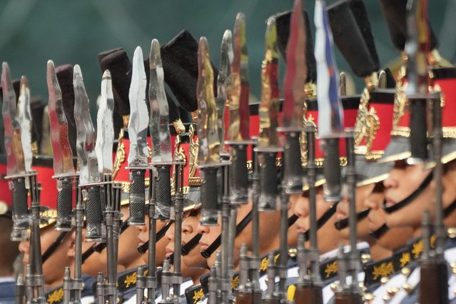 Philippines' troops stand at attention during the 88th anniversary of the Armed Forces of the Philippines at Camp Aguinaldo military headquarters in Quezon city, Philippines on Thursday, December 21, 2023. (Photo by Aaron Favila/AP Photo)