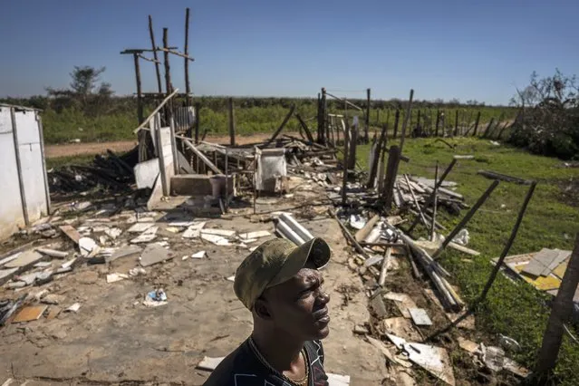 Javier Diaz poses for a photo next to his home that was destroyed by Hurricane Ian in La Coloma, in Pinar del Rio province, Cuba, Wednesday, October 5, 2022  (Photo by Ramon Espinosa/AP Photo)