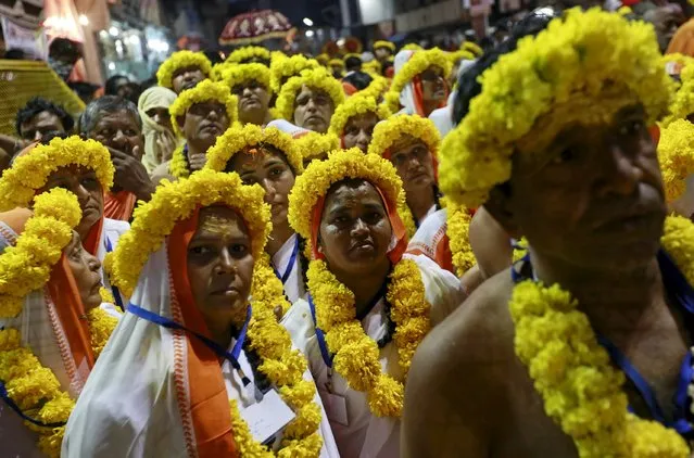 Devotees attend a procession before taking a dip in a holy pond during the second “Shahi Snan” (grand bath) at “Kumbh Mela”, or Pitcher Festival, in Trimbakeshwar, India, September 13, 2015. (Photo by Danish Siddiqui/Reuters)