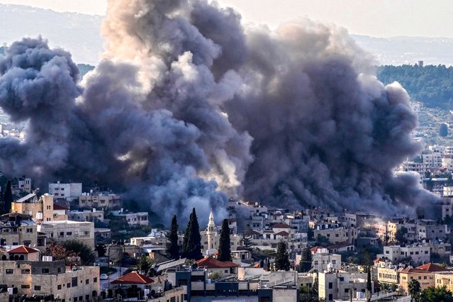 Smoke billows from the site of several explosions during an Israeli raid on the Jenin camp for Palestinian refugees on February 2, 2025. The Israeli military launched a major offensive in the West Bank last month dubbed “Iron Wall” aimed at rooting out Palestinian armed groups from the Jenin area, which has long been a hotbed of militancy. (Photo by Mohammad Mansour/AFP Photo)