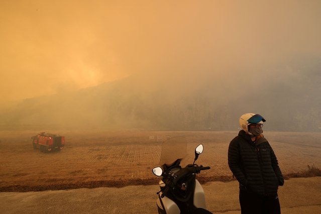 A resident looks around the area devastated by a wildfire, in Uiseong, South Korea on March 25, 2025. (Photo by Yonhap/Reuters)