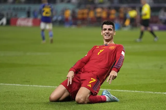 Spain's Alvaro Morata celebrates after scoring the opening goal of his team during the World Cup group E soccer match between Japan and Spain, at the Khalifa International Stadium in Doha, Qatar, Thursday, December 1, 2022. (Photo by Darko Vojinovic/AP Photo)
