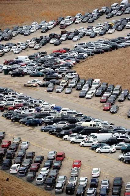 Tens of thousands of vehicles damaged by super storm Sandy are being temporarily stored on runways and taxiways at Calverton Executive Airpark in Calverton, New York, on January 9, 2013 in this aerial view. Insurance Auto Auctions Inc, a salvage auto auction company specializing in total-loss vehicles, acquired the cars and trucks that were damaged, destroyed or flooded by the storm and needed a place to store them. The company made a deal with the Town of Riverhead to lease the airport land and then the vehicles are auctioned online. AFP PHOTO/Stan HONDASTAN HONDA/AFP/Getty Images
