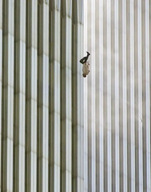 In this Tuesday, September 11, 2001 file picture, a person falls headfirst from the north tower of New York's World Trade Center. This iconic image is included in Time magazine's most influential images of all time, released Thursday, Nov. 17, 2016, through a new book, videos and a website, Time.com/100photos. (Photo by Richard Drew/AP Photo)