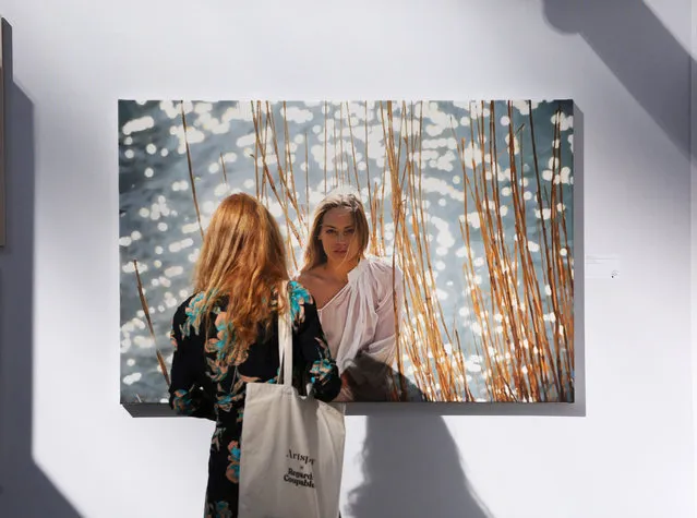 A woman looks at an artwork during the preview of the Art Paris 2020 held at the Grand Palais in Paris, France, September 9, 2020. Originally scheduled for April, Art Paris, France's second-biggest modern and contemporary art fair, opens its door to the public from Sept. 10 to 13. (Photo by Chine Nouvelle/SIPA Press/Rex Features/Shutterstock)