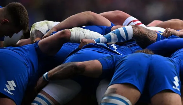 The tattooed arm of Italy's lock Niccolo Cannone (R) is pictured during a scum in the Six Nations international rugby union match between England and Italy at Twickenham Stadium, west London, on February 12, 2023. (Photo by Ben Stansall/AFP Photo)