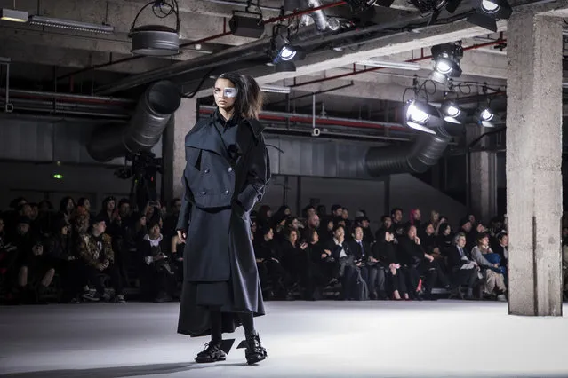 A model wears a creation for the Yohji Yamamoto ready-to-wear fall/winter 2018/2019 fashion week runway show in Paris, Friday, March 2, 2018. (Photo by Vianney Le Caer/Invision/AP Photo)