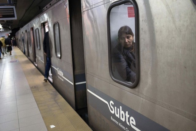 A commuter sits in a subway car in Buenos Aires, Argentina, May 17, 2024. Argentine commuters in the city were hit by an abrupt 360% increase in subway fares as part of President Javier Milei's austerity campaign. (Photo by Rodrigo Abd/AP Photo)