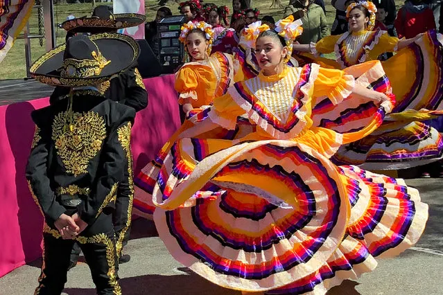 A dance troupe performs traditional Mexican dances at the 2018 National Cherry Blossom Festival near the Tidal Basin in Washington, D.C., U.S., March 18, 2018. (Photo by Will Dunham/Reuters)