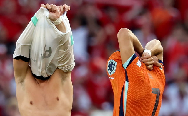 Christoph Baumgartner (L) of Austria and Xavi Simons of the Netherlands exchange shirts after the UEFA EURO 2024 group D match between Netherlands and Austria, in Berlin, Germany, 25 June 2024. Netherlands lost 2-3. (Photo by Abedin Taherkenareh/EPA)