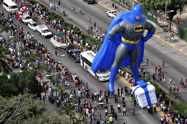 A balloon in the shape of comic hero Batman floats during a Christmas parade along the waterfront of the tourist resort of Acapulco December 25, 2014. (Photo by Claudio Vargas/Reuters)