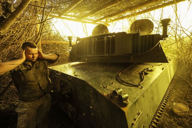 This handout photograph released by the press service of the 24th Mechanized Brigade of Ukrainian Armed Forces on July 22, 2025, shows servicemen of the 24th Mechanized Brigade fires a 122mm howitzer towards the Russian positions at an undisclosed location at the outskirts of Chasiv Yar, Donetsk region, amid the Russian invasion of Ukraine. (Photo by Oleg Petrasiuk/24th Mechanized Brigade via AFP Photo)