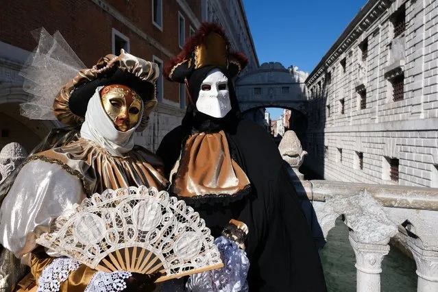 Revellers wear carnival masks and costumes to celebrate the Venice Carnival in Venice, Italy, February 12, 2022. (Photo by Manuel Silvestri/Reuters)