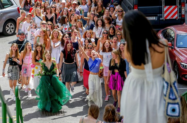 Swifties sing and dance in Vienna on Friday, August 9, 2024. Organizers of three Taylor Swift concerts in the stadium in Vienna this week called them off on Wednesday after officials announced arrests over an apparent plot to launch an attack on an event in the Vienna area such as the concerts. (Photo by Heinz-Peter Bader/AP Photo)