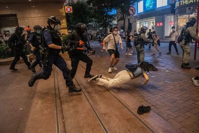 Police confront protesters in Hong Kong as they enforce China’s new national security rules in Hong Kong on July 1, 2020. (Photo by Lam Yik Fei/New York Times/Redux/Eyevine)