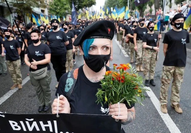 Members of the Women's veteran movement take part in the March of Defenders of Ukraine as part of Ukraine's Independence Day celebrations, in Kyiv, Ukraine on August 24, 2020. (Photo by Gleb Garanich/Reuters)
