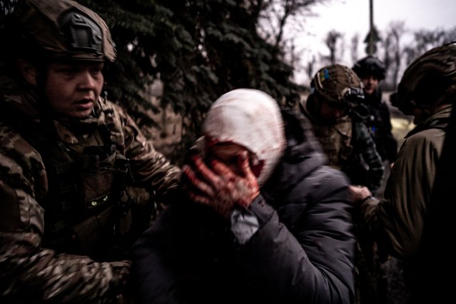 Ukrainian soldiers take a woman injured in an attack on a car with an FPV drone to the hospital for medical treatment in Pokrovsk, Donetsk Oblast, Ukraine on January 29, 2025. (Photo by Vincenzo Circosta/Anadolu via Getty Images)