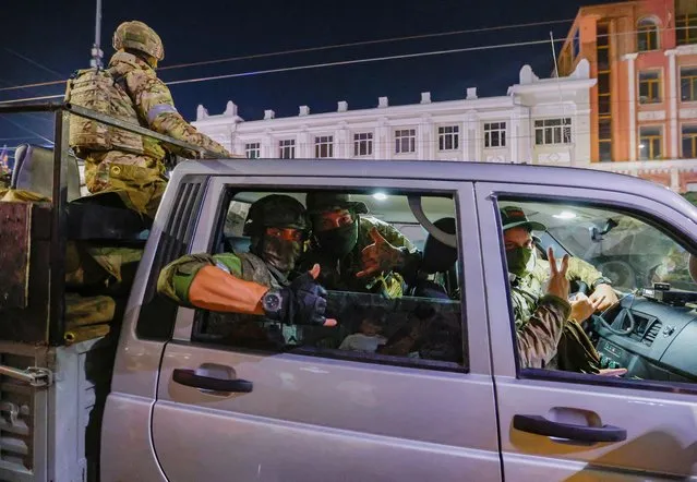 Fighters of Wagner private mercenary group pull out of the headquarters of the Southern Military District to return to base, in the city of Rostov-on-Don, Russia on June 24, 2023. (Photo by Alexander Ermochenko/Reuters)