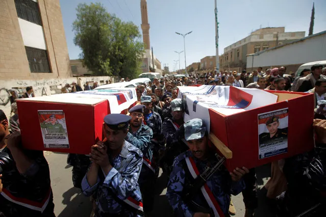 Soldiers carry the coffin of Major-General Omar bin Halles Yafei of the Inspector General at the Ministry of the Interior and his son, Capt. Mohammed Omar Yafei, who were killed by an apparent Saudi-led air strike that ripped through a wake attended by some of the country's top political and security officials on October 8, during their funeral in Sanaa, Yemen, October 27, 2016. (Photo by Mohamed al-Sayaghi/Reuters)