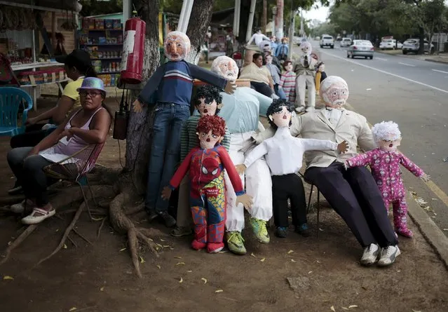 A woman sells handmade puppets along the street in Managua, Nicaragua December 30, 2015. (Photo by Oswaldo Rivas/Reuters)