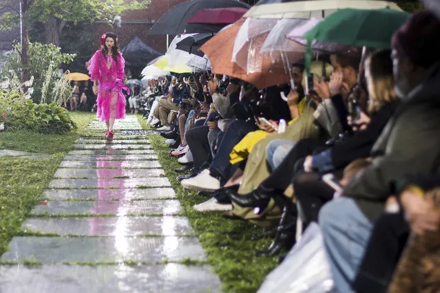 A model walks in the Rodarte show, which was held outside in the rain, during Fashion Week on Sunday, September 9, 2018 in New York. (Photo by Charles Sykes/Invision/AP Photo)