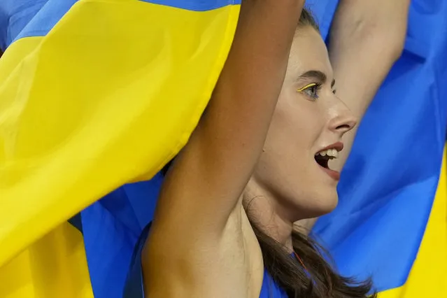 Yaroslava Mahuchikh, of Ukraine, celebrates after winning the gold medal in the Women's high jump final during the World Athletics Championships in Budapest, Hungary, Sunday, August 27, 2023. (Photo by Matthias Schrader/AP Photo)
